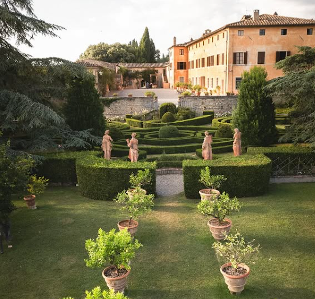 Gardens and facade of Villa Catignano: wedding estate set amid rolling vineyards, olive groves and manicured Italian gardens near Siena in the heart of the Chianti Classico region.