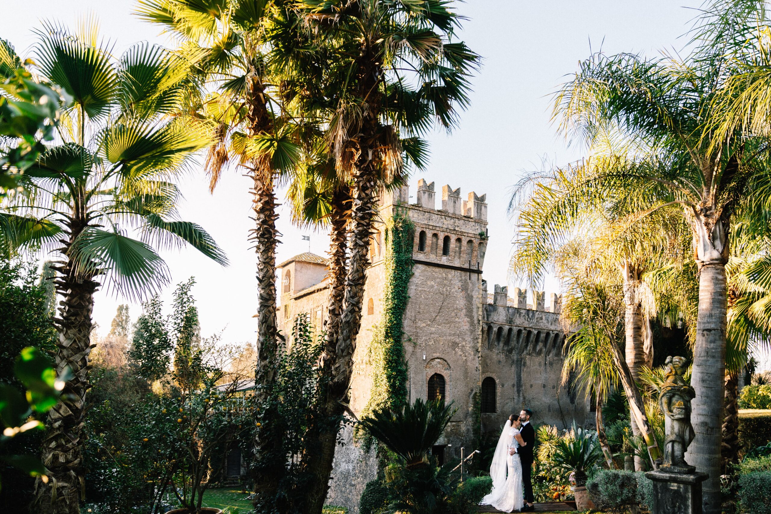 The kiss of newlyweds in the Historic Castello di Torcrescenza, Rome - Italy