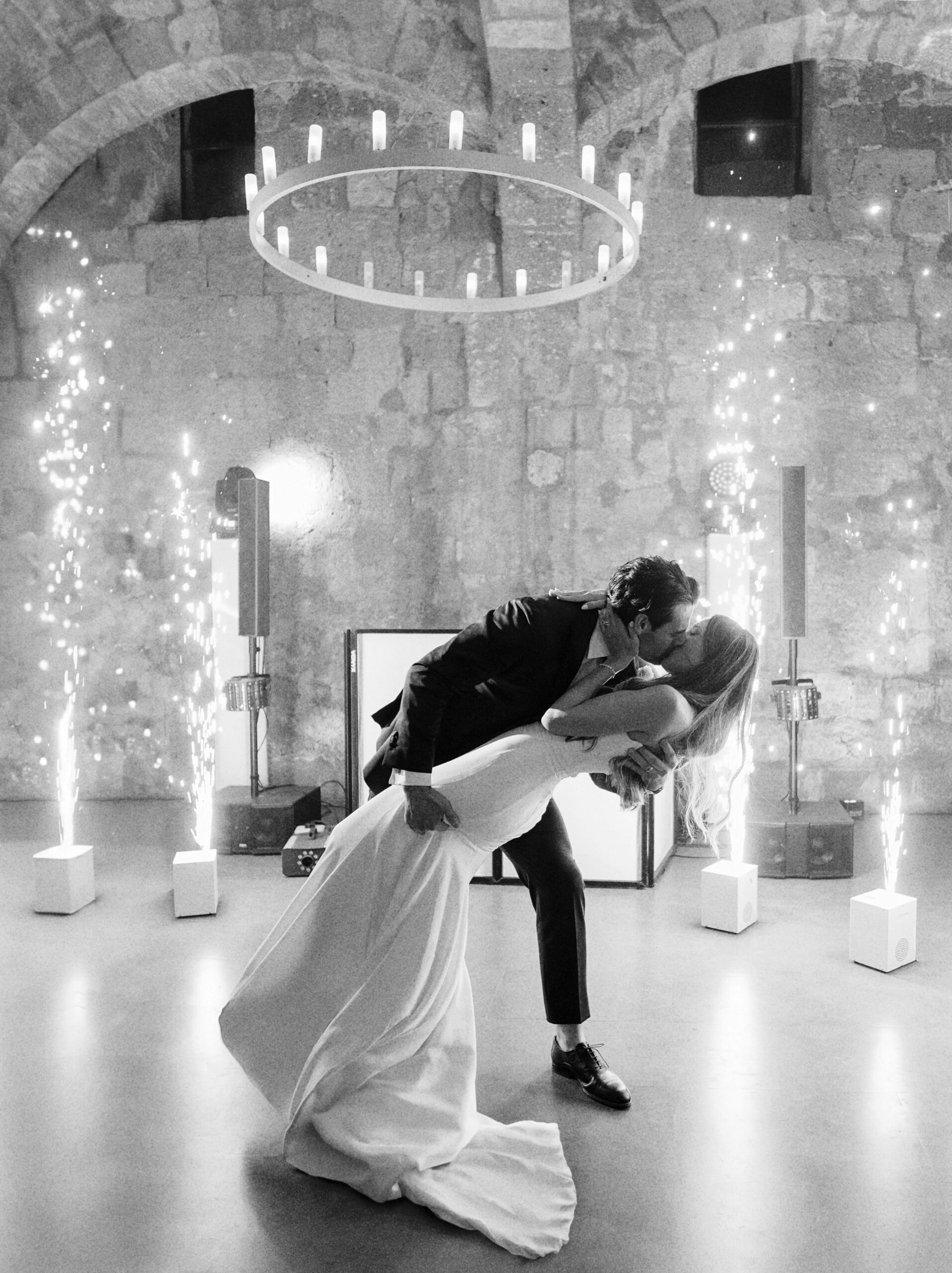 The bride and groom romantic kiss during the wedding party