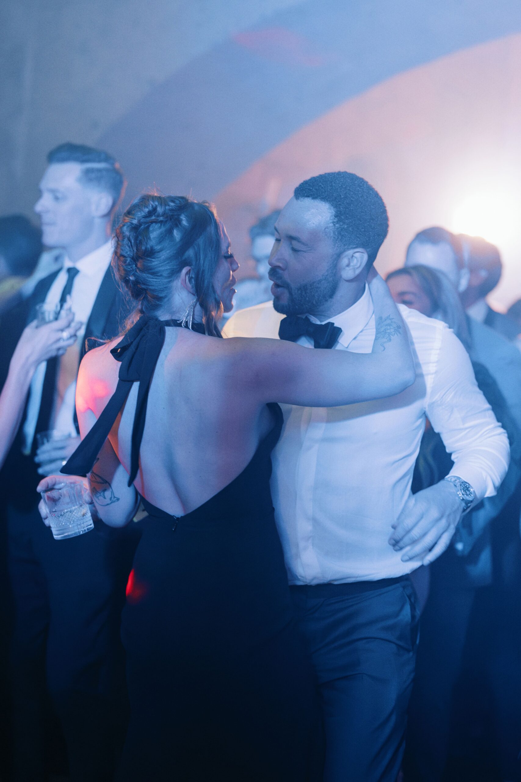 Wedding guests dancing during the night party