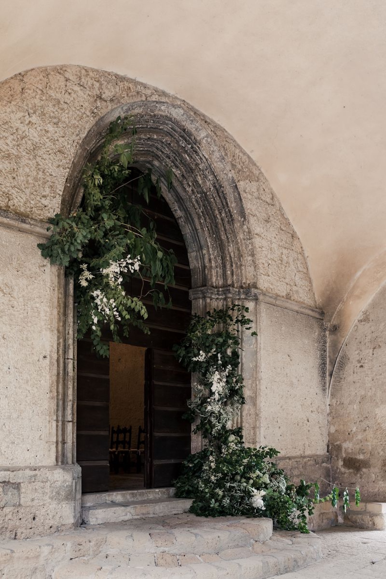 The entrance of the little chapel in the beautifully restored 12th‑century Benedictine abbey amid the rolling hills and olive groves near Orvieto in Umbria, Italy.