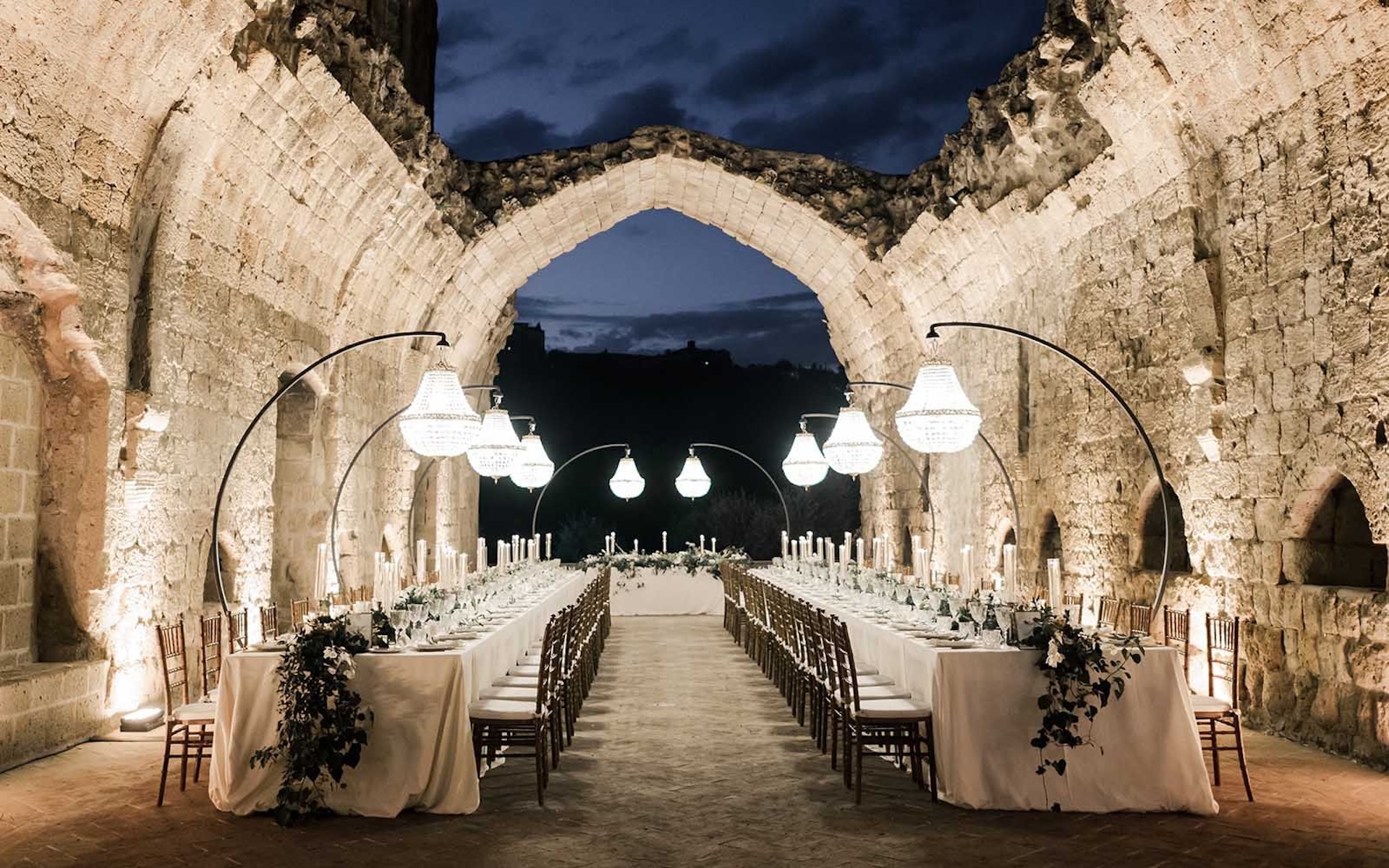 A wedding setup with lights from above in La Badia di Orvieto in Umbria, Italy.